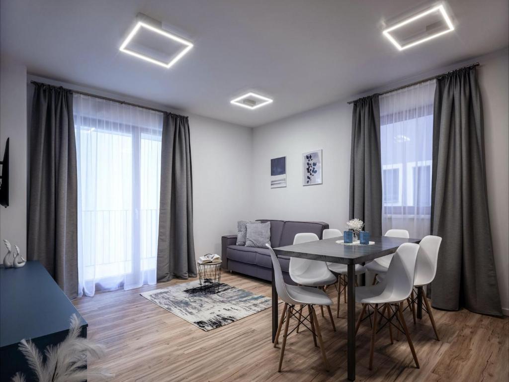 a living room with a table and a couch at Premium apartment in Schwaz in Schwaz