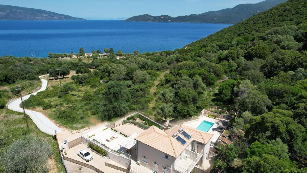 an aerial view of a house with a lake at Paradise Villas in Sami