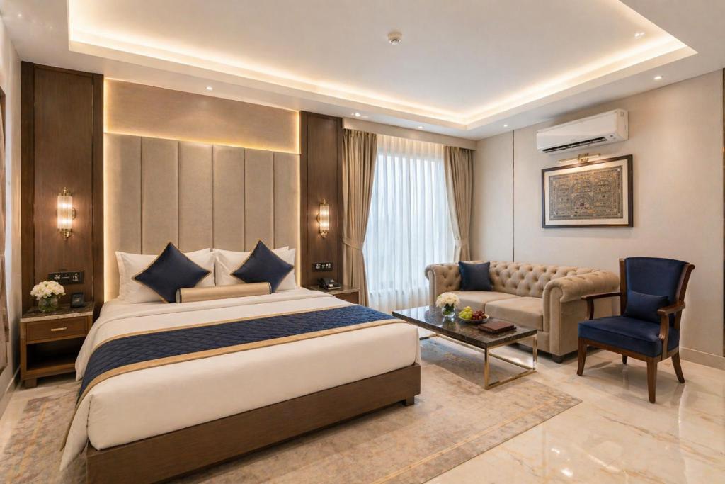 a hotel room with a bed and a couch at Hotel Prak Tree Sector 20 Noida in Noida