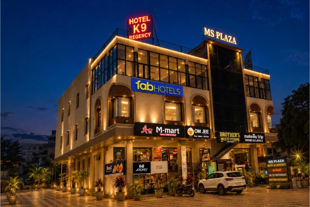 a large building with a sign on top of it at FabHotel K9 Regency in Zirakpur