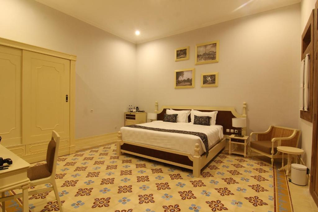 Postel nebo postele na pokoji v ubytování Java Villas Boutique Hotel & Resto