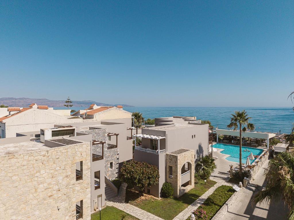 an aerial view of a house and the ocean at Erato Beach Hotel Adults Only by Smile Hotels in Platanias