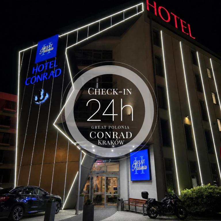 a sign in front of a hotel called check in at Hotel Great Polonia Conrad Kraków in Krakow
