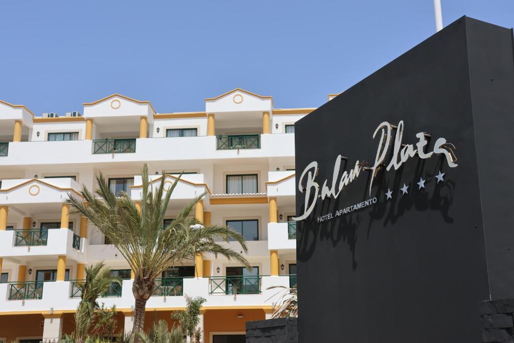 a sign for a hotel in front of a building at Balaia Plaza in Albufeira