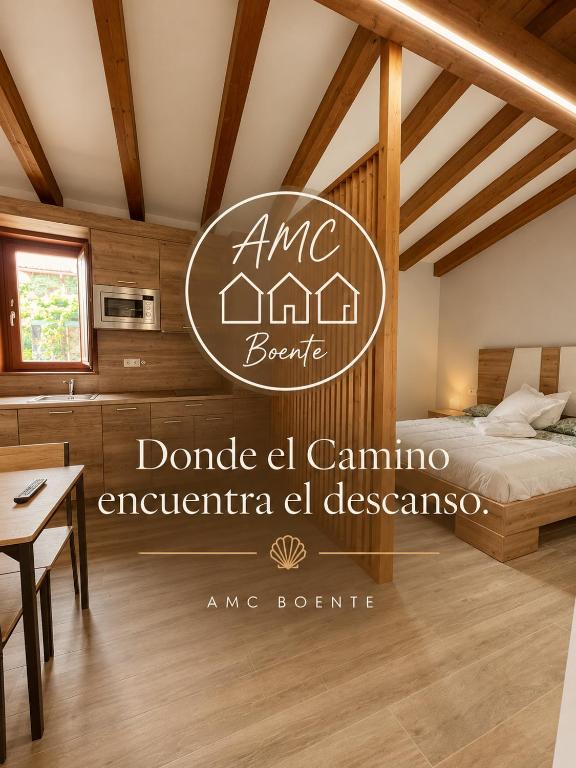 a bedroom in a house with a bed and a table at AMC Boente in Arzúa