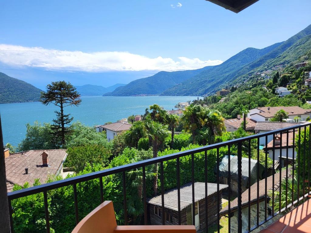 a view of a lake from a balcony at Holiday Home Stellina del Sole by Interhome in Brissago