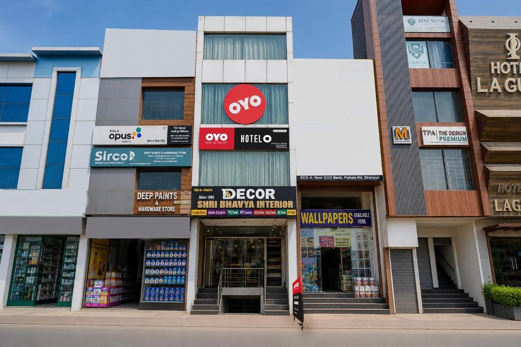a facade of a building with a store at Super Collection O by OYO Patiala Road Crossway Zirakpur Formerly Lavish in Zirakpur