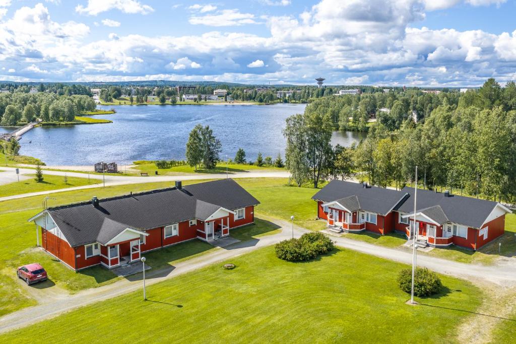 an aerial view of a house with a lake at LODGE Hostel Kuusamo in Kuusamo