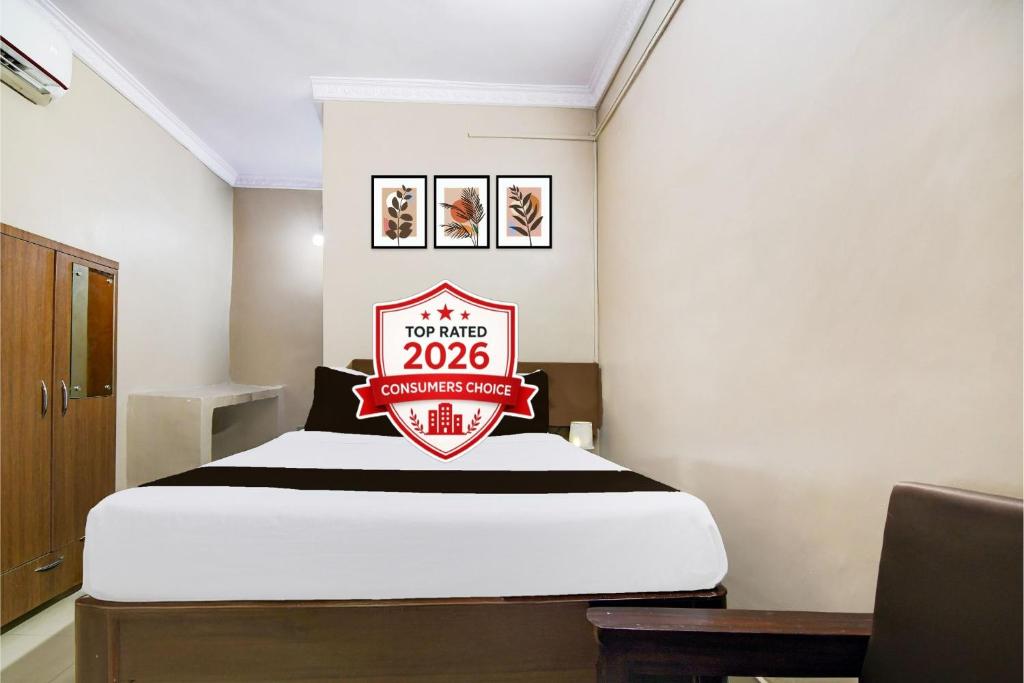 a room with a bed with a sign on it at Super Collection O NIT More Adityapur Formerly Hotel Subheksha in Jamshedpur