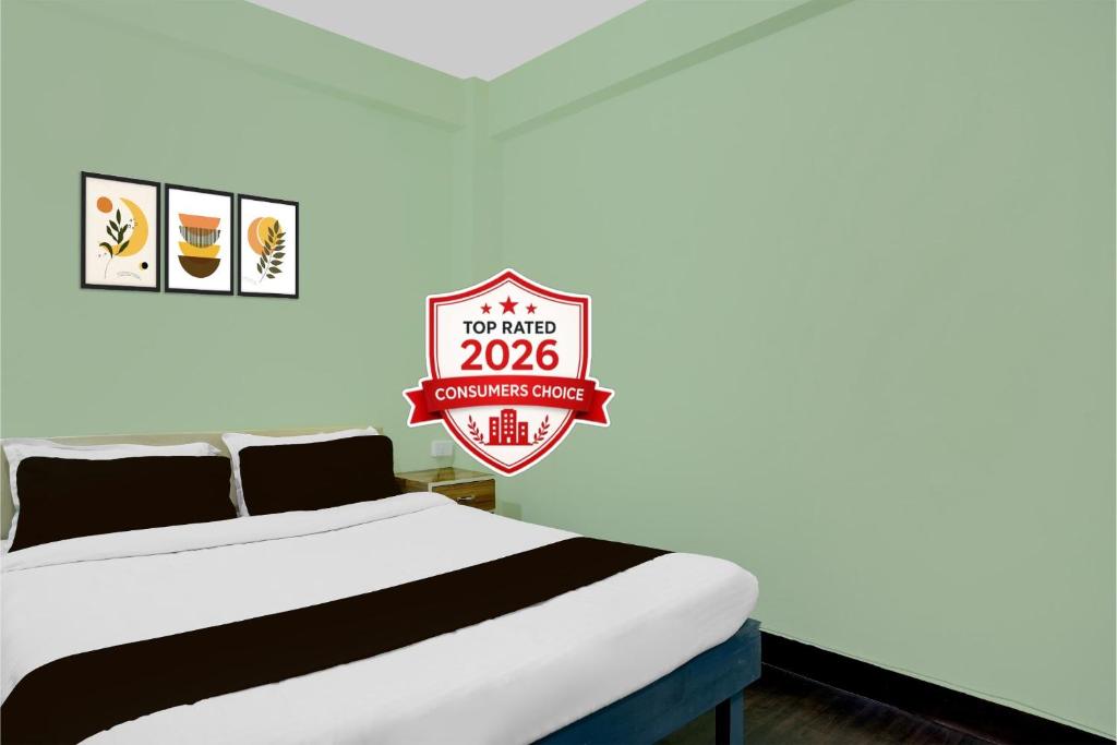 a bedroom with a bed and a sign that says no more at Super Collection O SRS Residency in Shillong