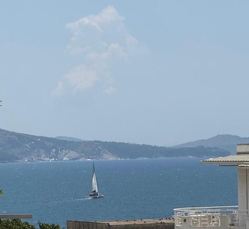 a sailboat in a large body of water at Riviera Central Escape in Sarandë