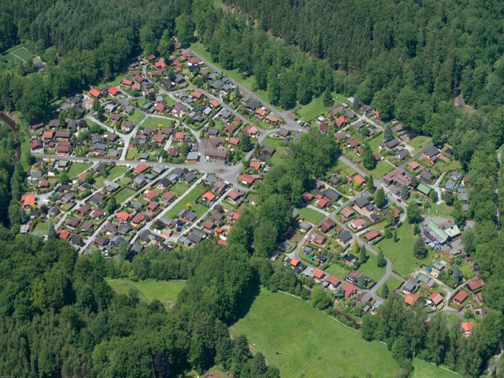 an aerial view of a town in a forest at Erholungspark Wilhelmsruh in Möhnesee