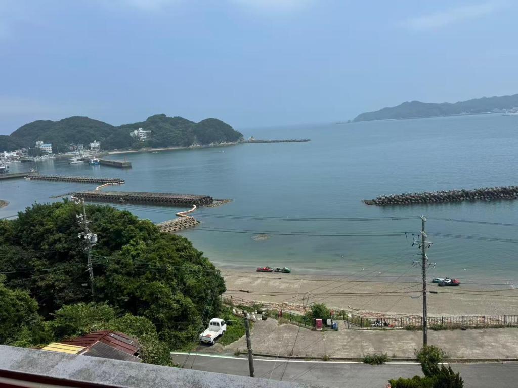 a view of a body of water with boats in it at 島の宿 in Toba