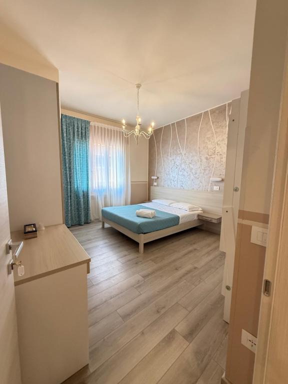 a bedroom with a bed in the middle of a room at Mar ricco Room 5 in Chioggia