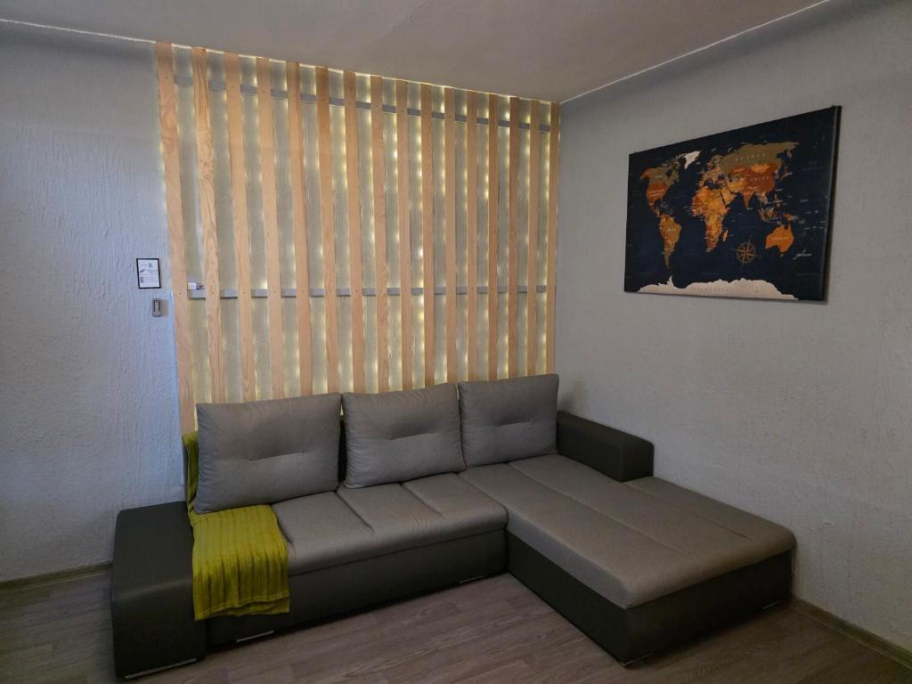 a couch in a living room with a window at U Lose in Liberec