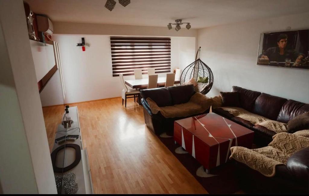 a living room with a couch and a table at The Red Lounge in Strumica