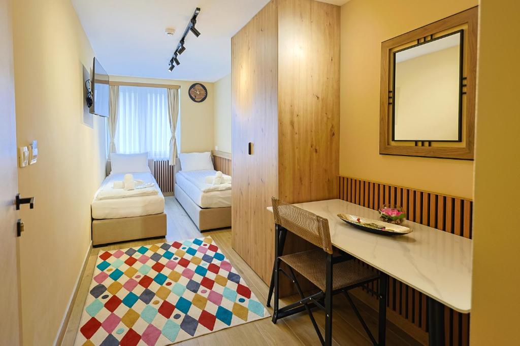 a small room with a table and a mirror at FourMountains-Trebević in Sarajevo