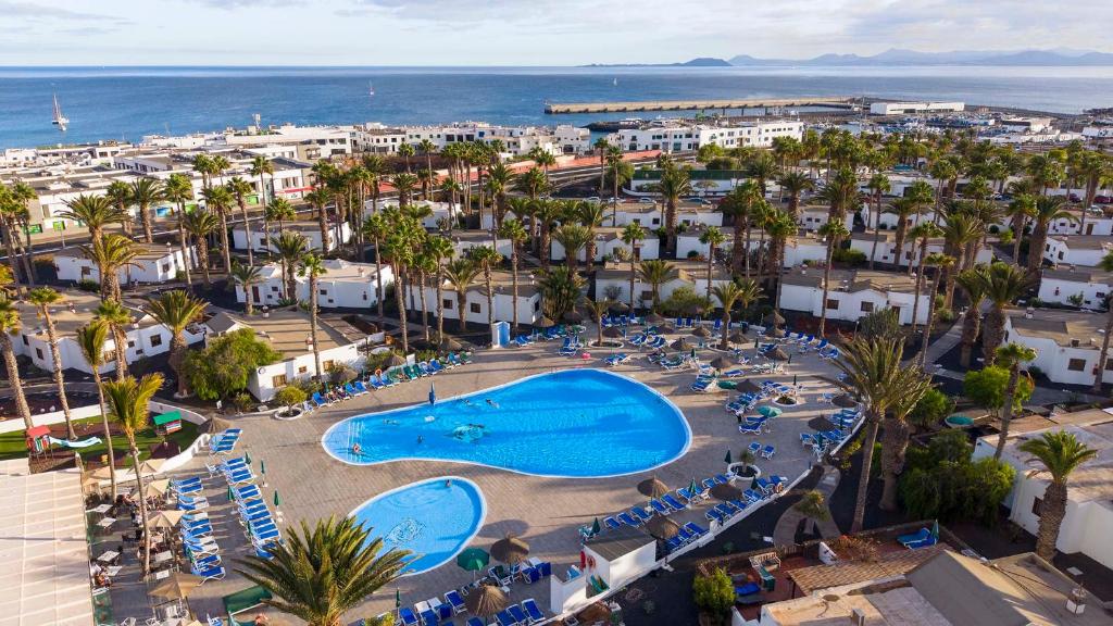 an aerial view of a resort with a swimming pool at Ona Las Brisas in Playa Blanca