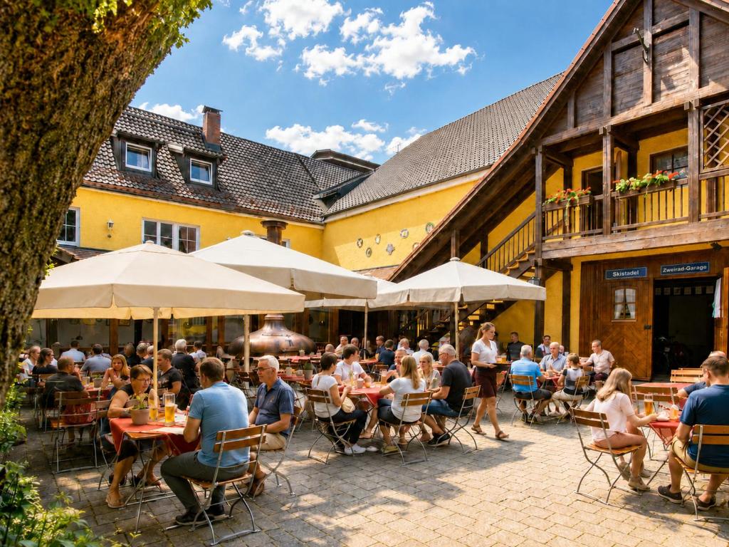 a group of people sitting at tables outside a building at Hotel Gasthof Post in Nesselwang