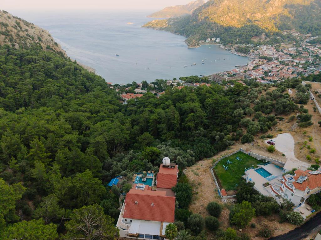 an aerial view of a town and a lake at Karma homes in Turunç
