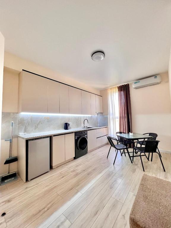 a kitchen with a table and chairs in a room at Hayrapetyan Guest House in Yeghegnadzor