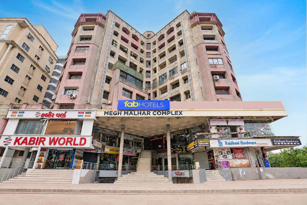 a large building with a market in front of it at FabHotel Royal Midway in Gandhinagar
