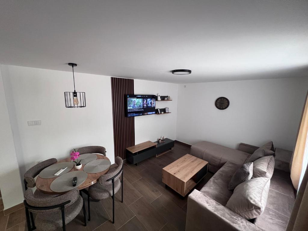 a living room with a couch and a table at Smeštaj Stamenić in Bajina Bašta