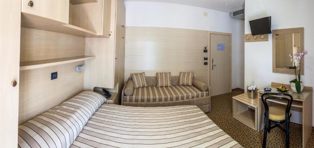 Postel nebo postele na pokoji v ubytování Hotel Christian