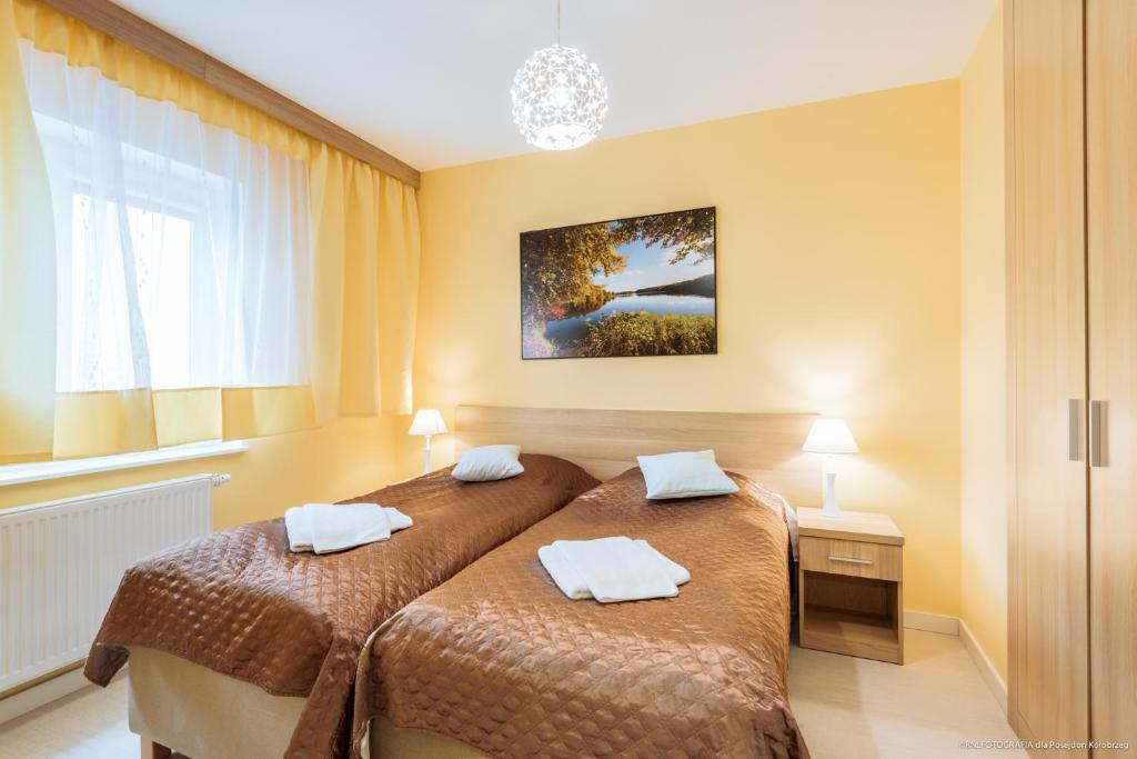 Posteľ alebo postele v izbe v ubytovaní Apartament Posejdon Kołobrzeg