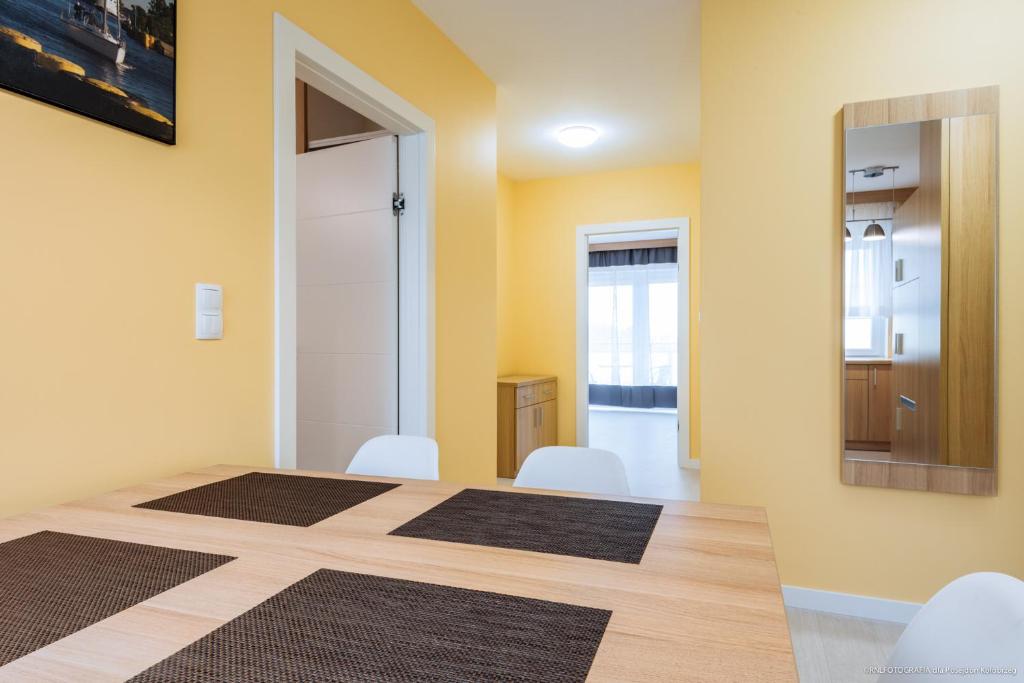 Posteľ alebo postele v izbe v ubytovaní Apartament Posejdon Kołobrzeg