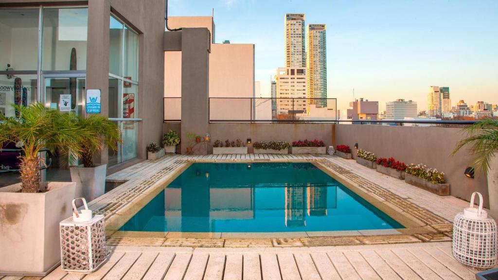 a swimming pool on the roof of a building at Be Hollywood! in Buenos Aires