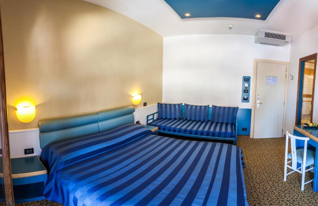 Postel nebo postele na pokoji v ubytování Hotel Christian
