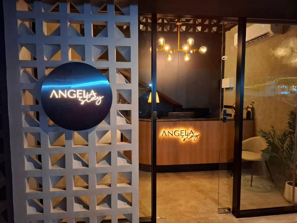 a wine cellar with a wall of wine bottles at Angela Stay in Pattaya