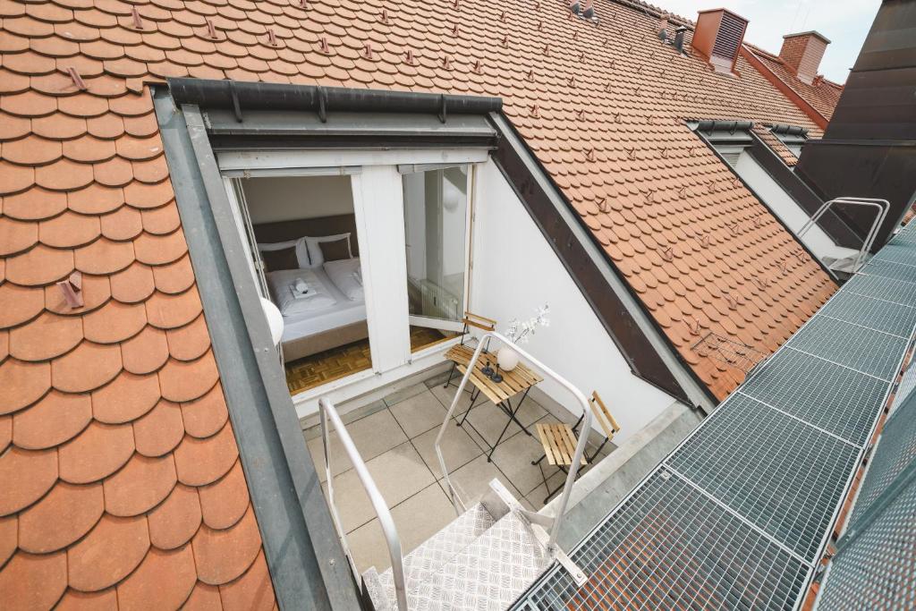 an extension to a house with a toilet on a roof at GH Luxury Apartments Graz, Gösser Haus in Graz