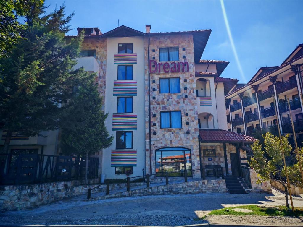 a building with the word dream on it at Apart Hotel Dream in Bansko
