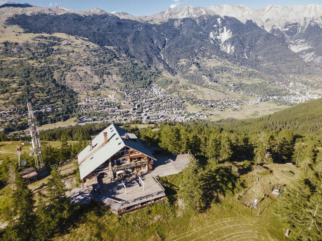an aerial view of a house in the mountains at Le Refuge du Grand Hôtel - Altitude 1900 m - Accès Cabine - Cabin Access in Saint-Chaffrey
