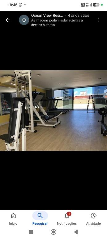 a picture of a gym with treadmills and a picture of a gym at Oceanview Apart Residence in Natal
