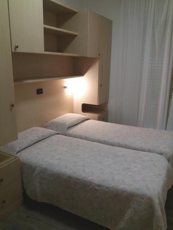 Postel nebo postele na pokoji v ubytování Hotel Christian