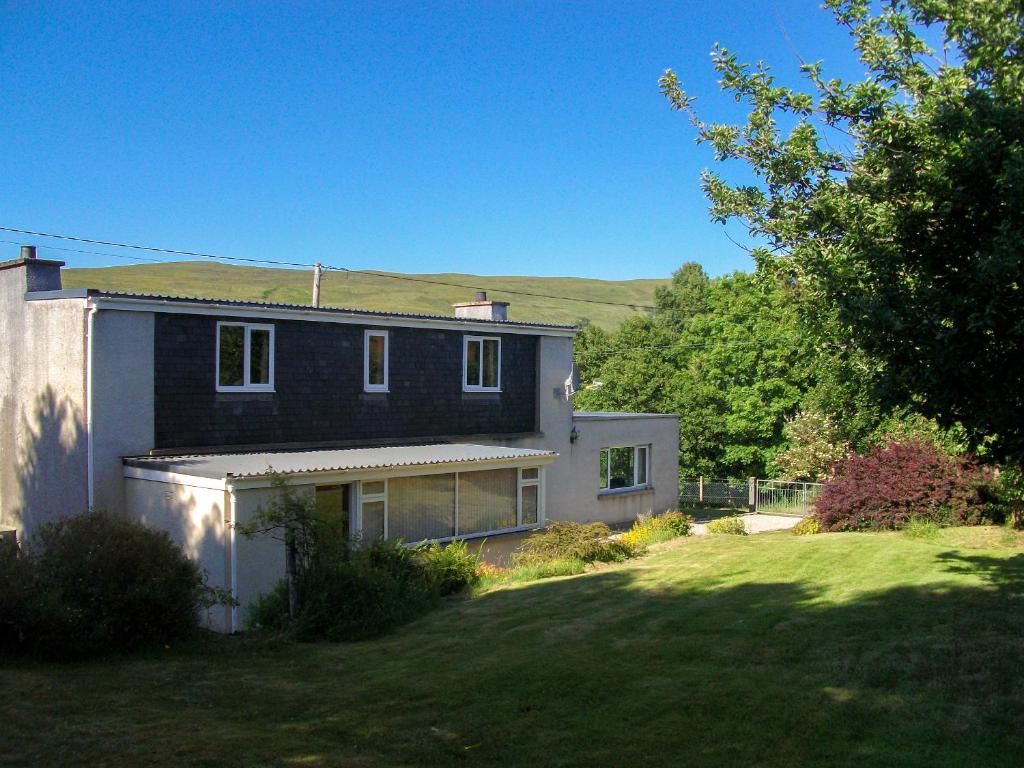 a house with a large yard in front of it at Lower Brae in Achnahanat