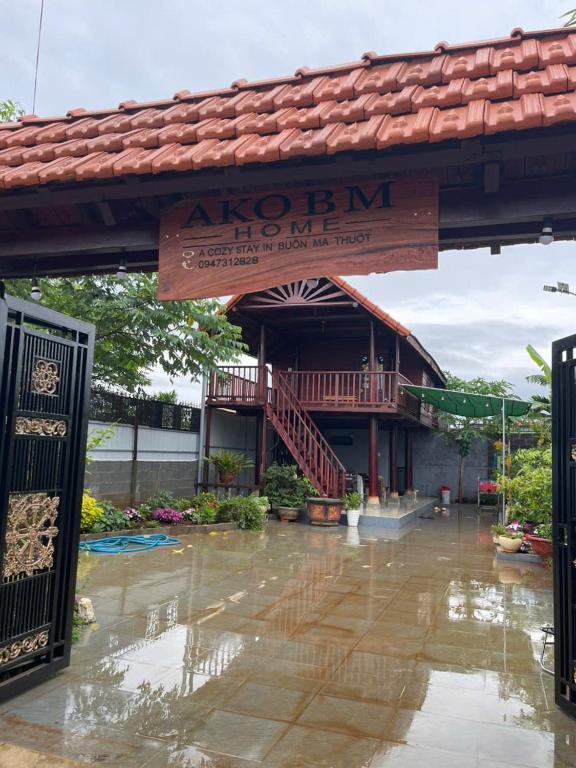 a flooded building with a sign in front of it at Ako BM homestay in Buon Ma Thuot