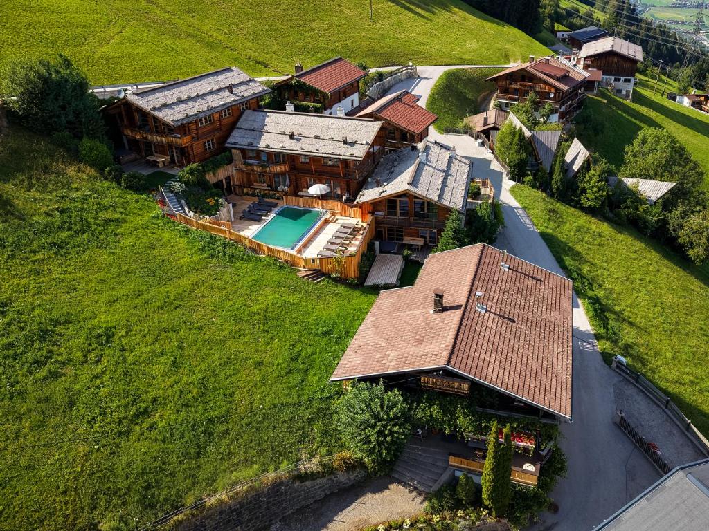 an aerial view of a house with a swimming pool at HochLeger - Chalet Refugium am Berg in Aschau
