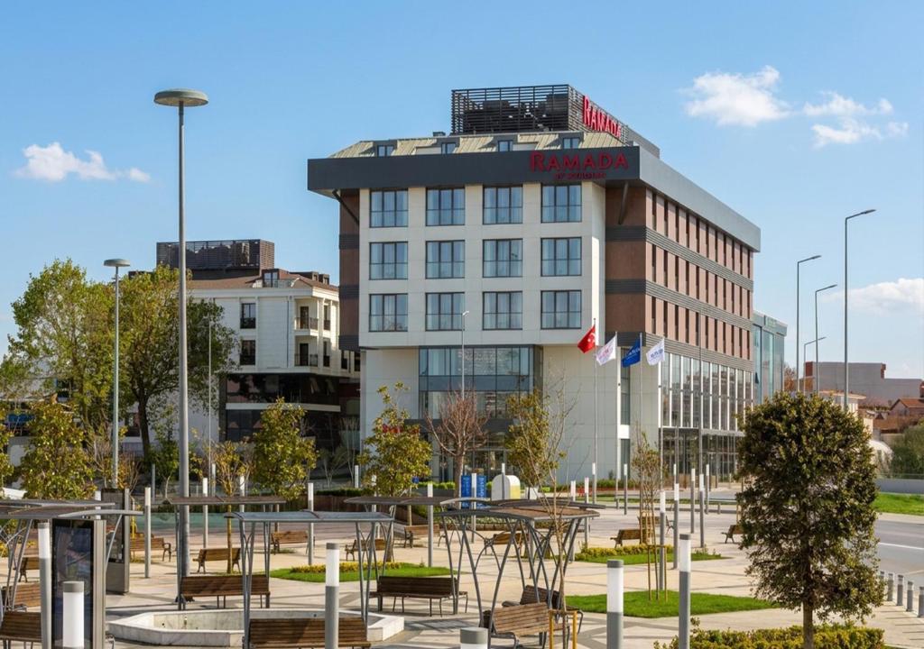 a building with a lot of tables and chairs at Ramada by Wyndham Arnavutkoy in Istanbul