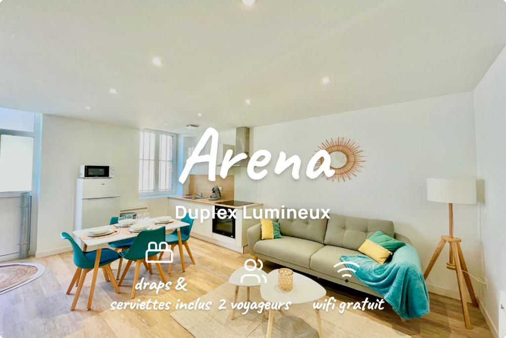 a living room with a couch and a table at *ARENA* - duplex lumineux in Reims