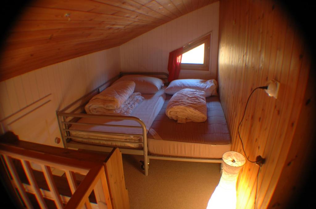 Postel nebo postele na pokoji v ubytování Chalet Valdonga