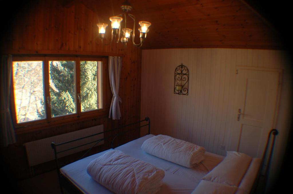 Postel nebo postele na pokoji v ubytování Chalet Valdonga