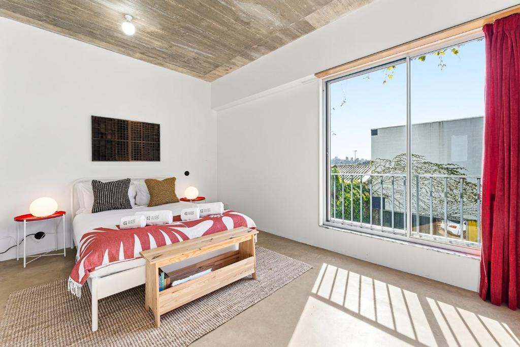 a bedroom with a bed and a large window at GuestReady - Freixo Apartments in Porto