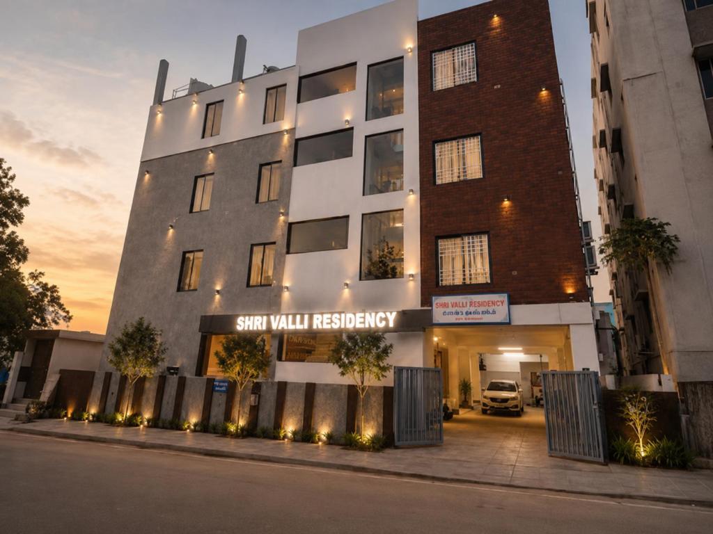 a building with a sign that reads sun will residency at Shri Valli Residency in Palni