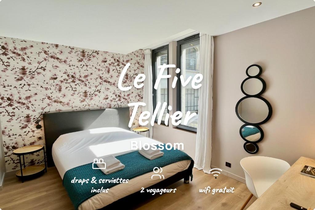 a bedroom with a bed with a hello sign on the wall at Le Five Tellier - Blossom in Reims
