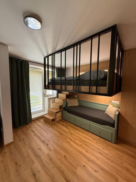 a room with two bunk beds in a house at Apartmán Na Hvězdné Mýtince in Jeseník