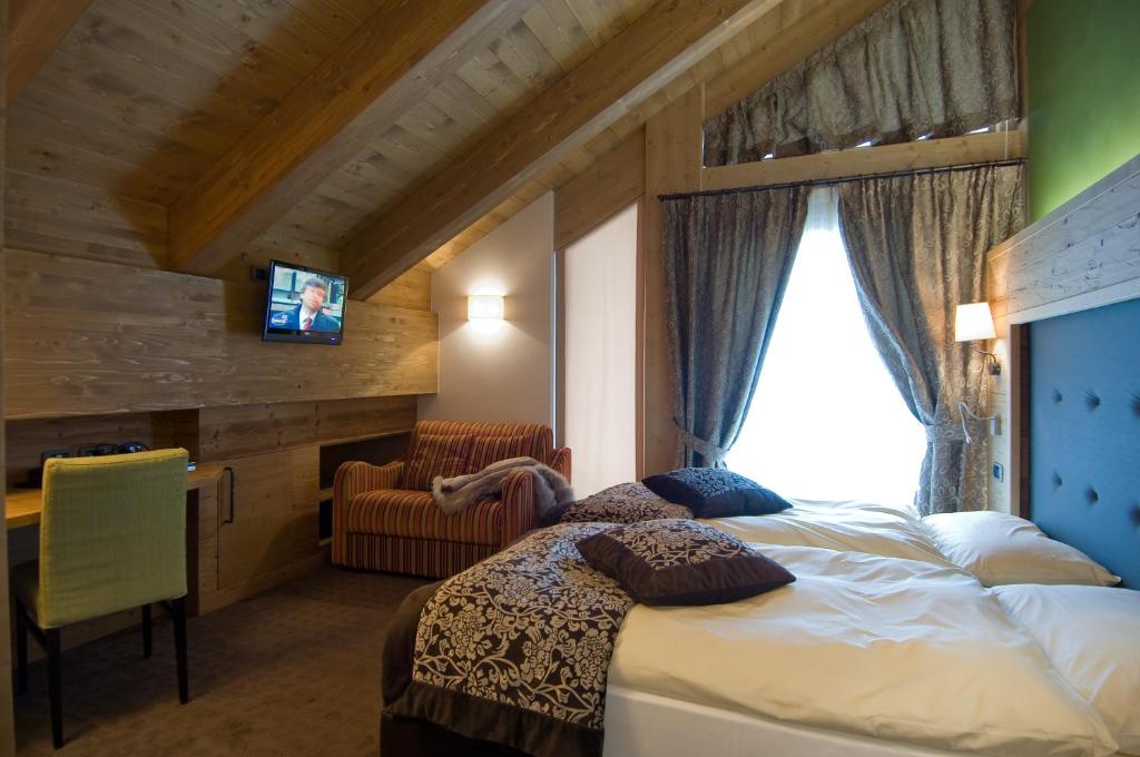 Postel nebo postele na pokoji v ubytování Hotel Vedig